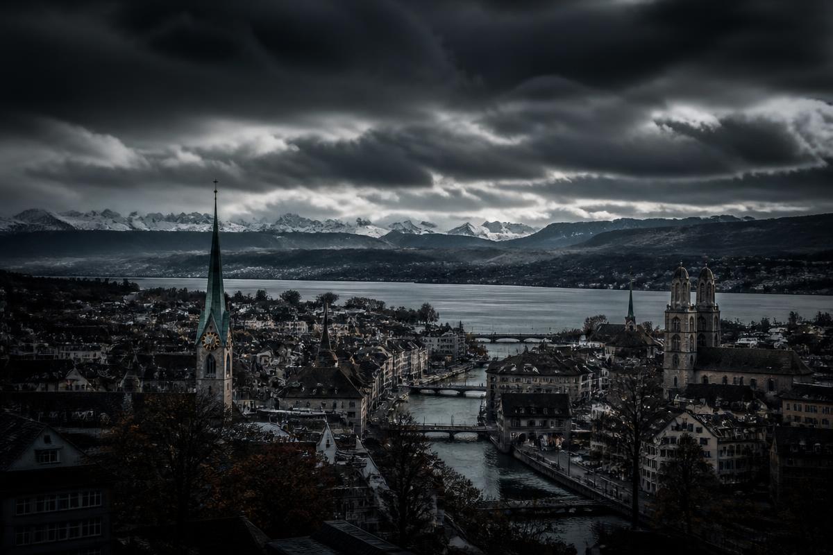 Zurich cityscape with lake and Alps under a dramatic dark sky